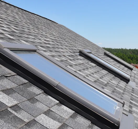 Finished skylight installation viewed along the roof slope
